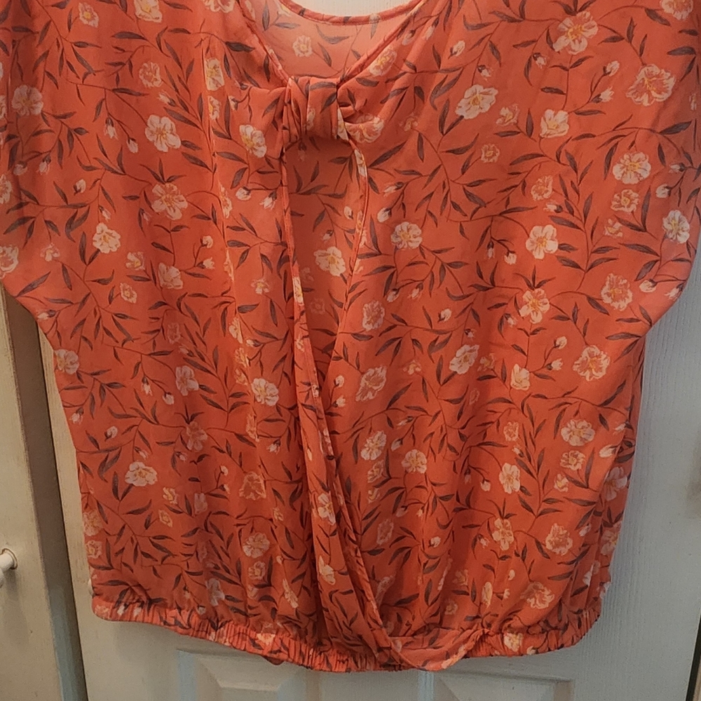 Peachy pink floral Torrid top with open back and elastic waistband. Size 2(xl)